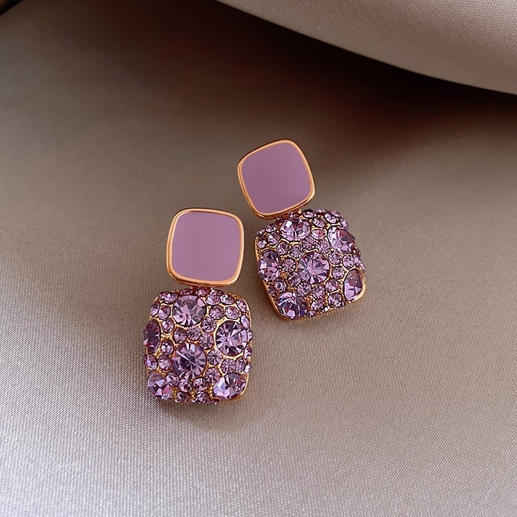 Boucles d'oreilles violettes de luxe avec incrustation de zirconium