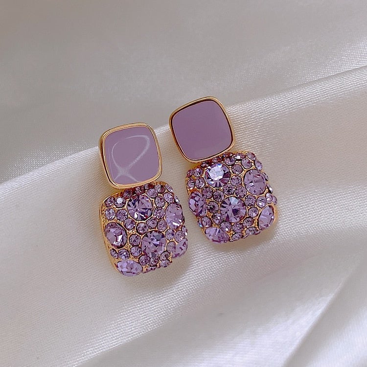 Boucles d'oreilles violettes de luxe avec incrustation de zirconium