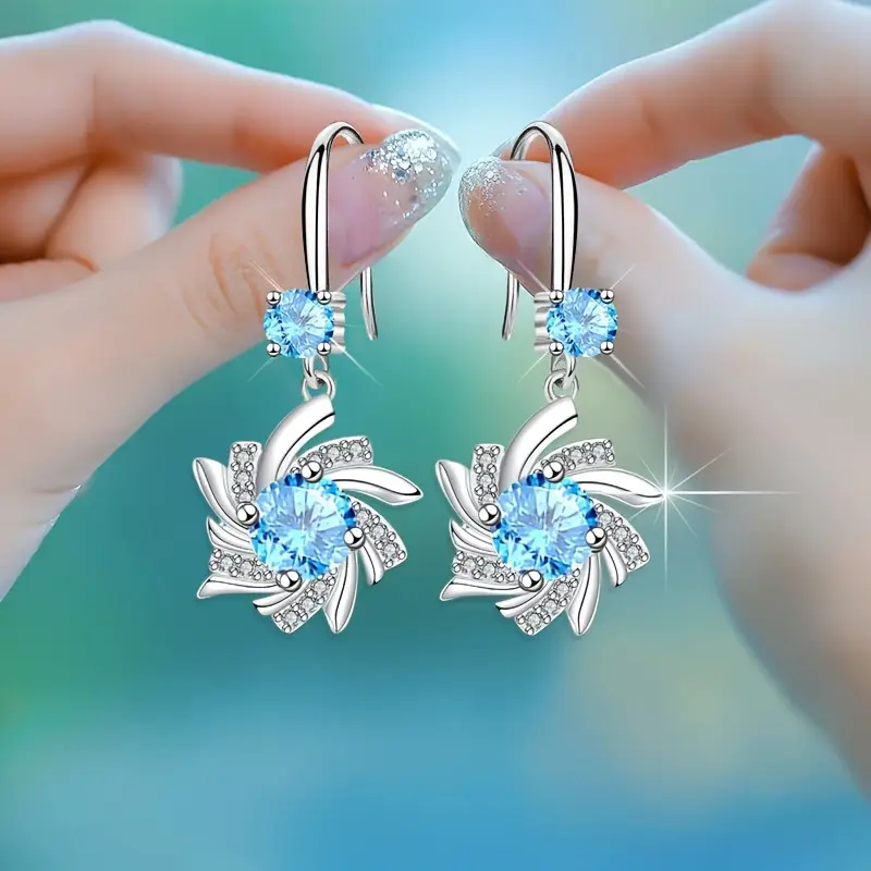 Boucles d'oreilles spirale bleue lumineuses